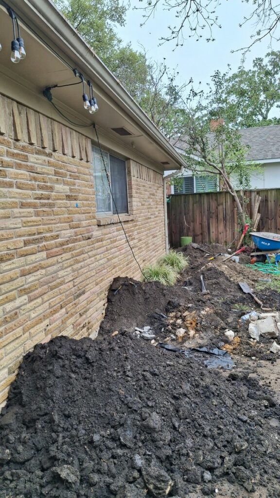 Foundation Repair Contractors Install Piers and Drain Upgrade in Richardson, TX