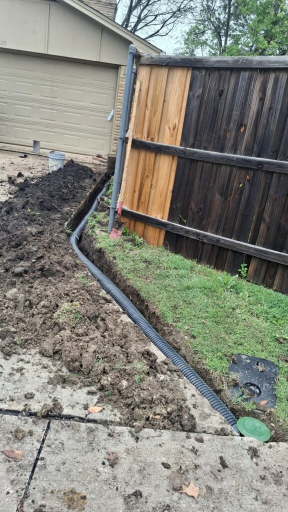 Foundation Repair Contractors Install Piers and Drain Upgrade in Richardson, TX